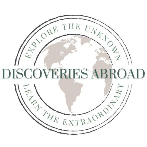 Discoveries Abroad Logo: "Explore the Unknown, Learn the Extraordinary."