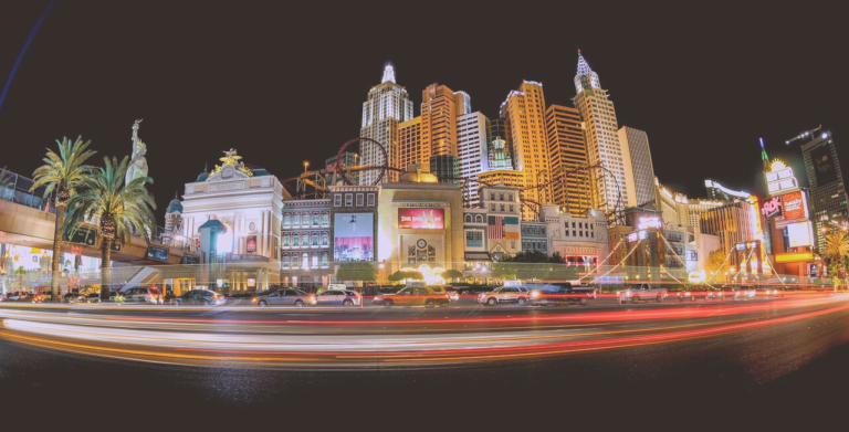 A blurry photo of the Las Vegas Strip with traffic.