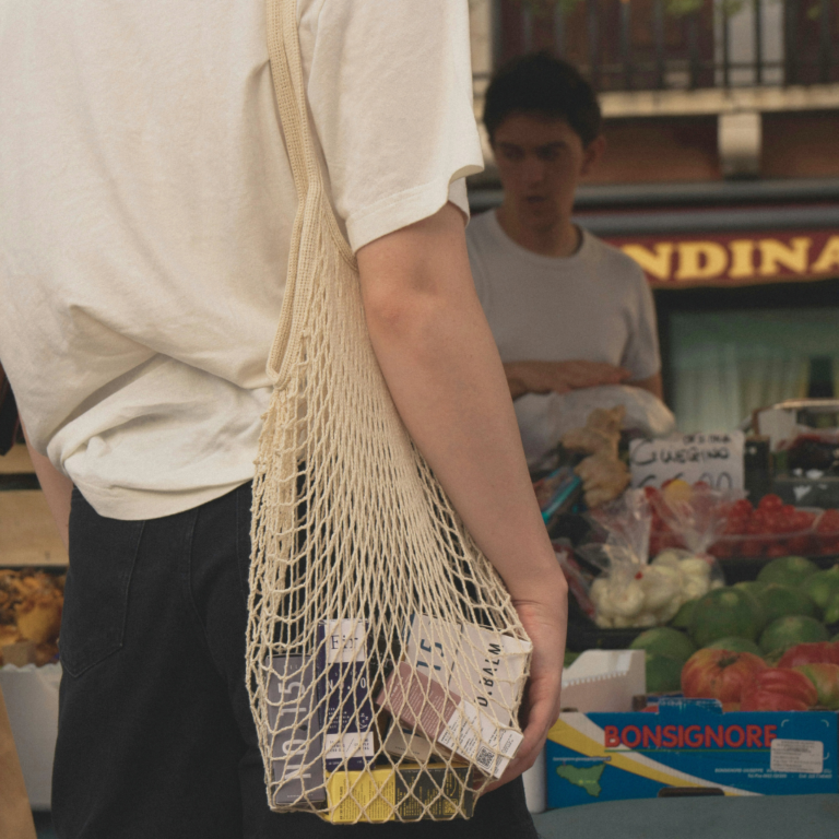 A young women grocery shopping at the market.