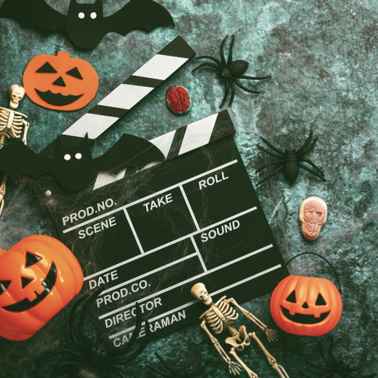 A little layout of Halloween pumpkins and skeletons with a directors clapperboard.