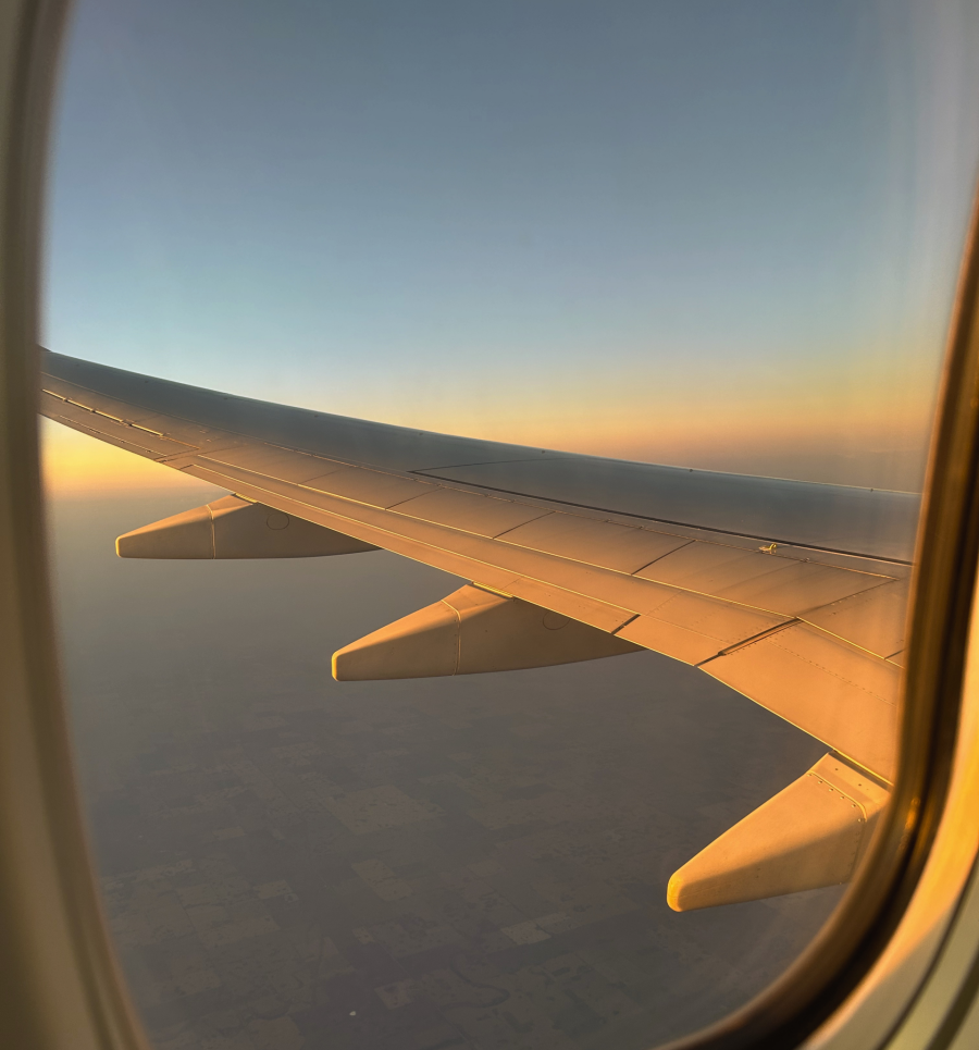 Sunset view from an airplane's window seat.